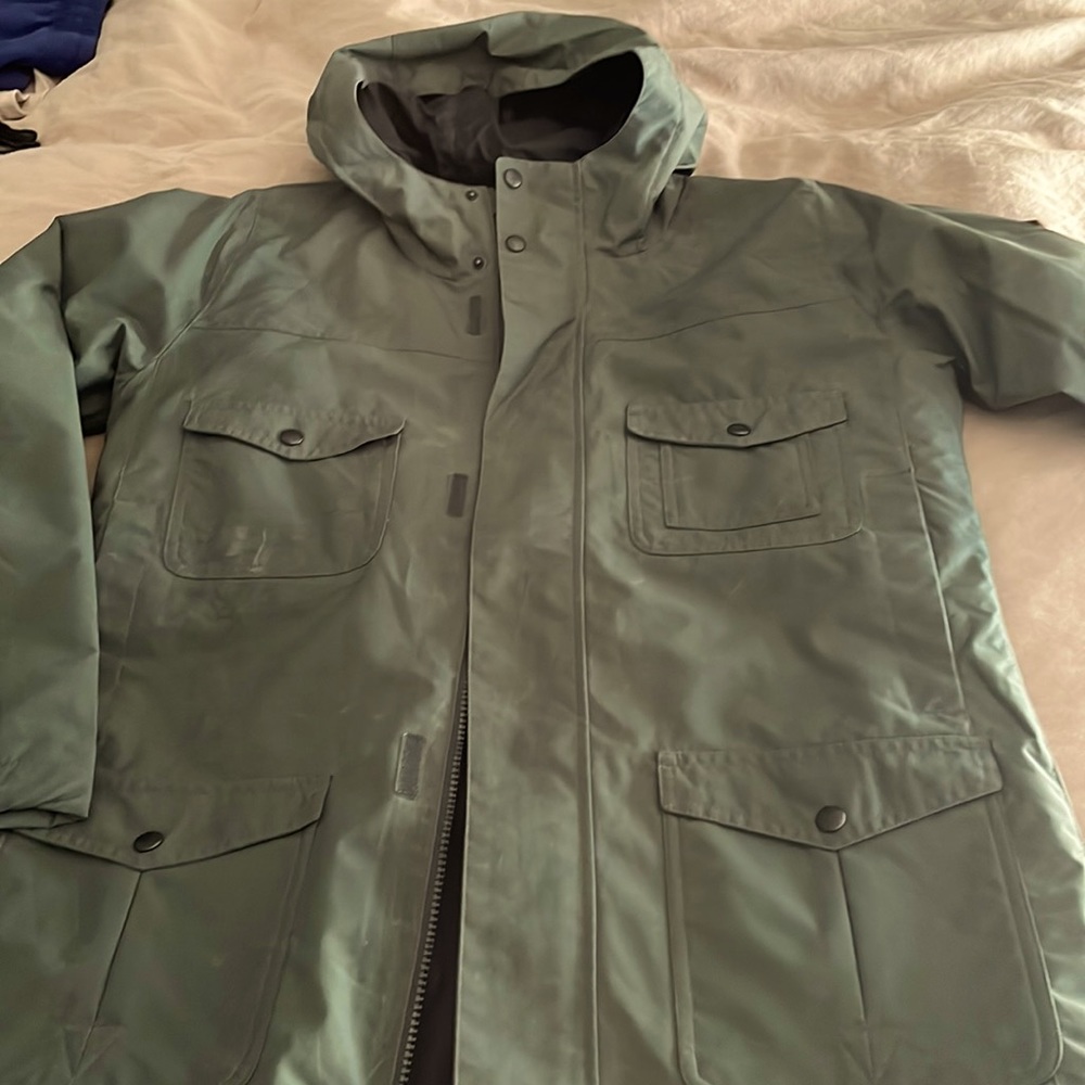 Brand new burton boy xl rain jacket,